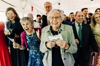 Older generation smiling and excited at wedding guests
