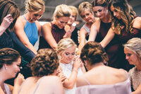 Prayer before wedding with bridemaids