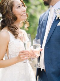 Bride and groom celebrating with champagne