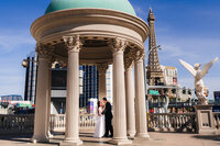 A couple dancing underneath a gazebo at the  Las Vegas Strip during their elopement.