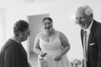 bride laughs with her mom and dad on her wedding day at The Eloise in Mount Horeb Wisconsin
