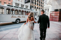Newly married couple walking through the streets of San Francisco after their city elopement, captured by San Francisco elopement photographer Kristin Smith.