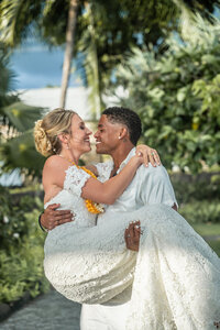 Wedding portraits of groom carrying bride, taken by kona hawaii wedding photographers