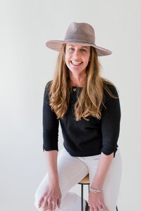 danielle muccillo of danielle muccillo photography posing for a branding session in a mesa az studio