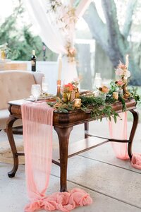Photo of sweetheart table on open air reception at Abby Holmes Estate