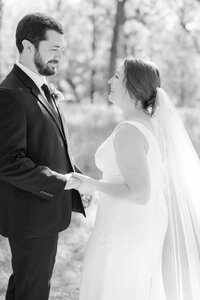 bride faces a mirror while looking to the side