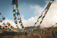 Colorful prayer flags fluttering in the wind in the Himalayas