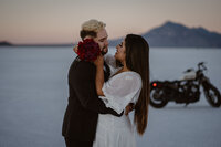 Couple elopes on the Utah Bonneville salt flats with their motorcycle.