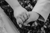 bride and groom hold hands in san diego wedding