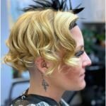 Side profile of Gena’s bold flapper-inspired finger waves and feather accessory styled by Your Girl Friday LV for a New Year’s Eve event in Las Vegas.