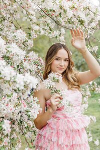 beautiful senior girl with pink flowers for her senior portrait session at Descanso Gardens in La Canada California