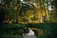 wedding couple on dock in forest