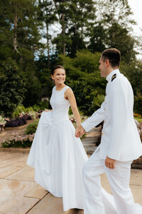 a groom lifting a bride on their wedding day