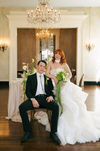 A bride and groom looking at the camera during their editorial bridal photos at their Nashville Wedding. 