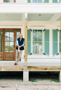 man leaning against porch
