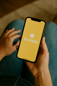 A person browsing the Bumble dating app on their phone, representing the use of professional dating profile photography to create confident, authentic images for online dating platforms in Minneapolis.