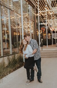 newly engaged couple on south congress avenue wearing casual clothing in Austin. Photo by photographer in Austin | Photos by Meggie
