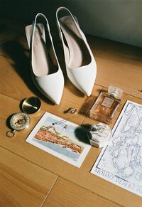 Bridal details including wedding shoes, compass, map, rings, and perfume taken by Shelby Ann Photos, east coast wedding photographers