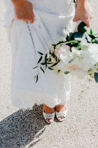 wedding shoes bride holding her dress up