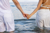Maui Elopement Photographer captures couple holding hands in water