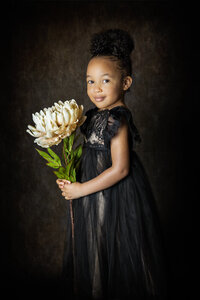 little black  girl holding flowers