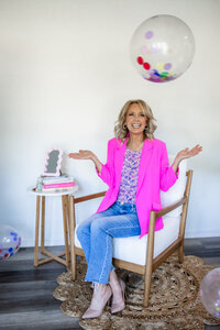 Joplin personal stylist wearing a bright pink blazer