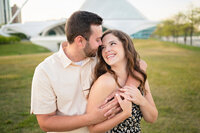engagement photo of couple by milwaukee art museum