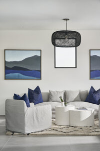 JSF Design pool house with custom outdoor seating and statement blue artwork