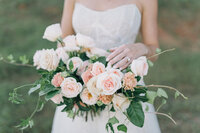 A Birmingham bride on her wedding day holding her bouquet