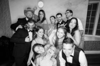 New York guests pose for photos at a wedding reception on Long Island in New York. 
