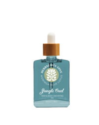 A bottle of Herbalista Love Jungle Mud facial serum, featuring a teal-colored glass bottle with white typography and a wooden dropper cap. The design includes an intricate botanical logo, emphasizing the product's natural and organic ingredients. Set against a peach-colored background, the packaging reflects the earthy and rejuvenating qualities of the serum.