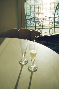Film photography of couple kissing on the beach at Talm Beach House, Port Stephens