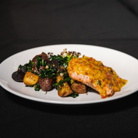 Salmon with fresno sofrito butter sauce Max Dales Steak and Chop House Restaurant