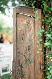 Wood door to entryway of the Alegria Garden at Royal Palms Scottsdale