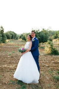 groom-holding-bride-at-luxury-destination-wedding-in-provence-leslie-choucard-photography