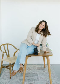 A professional headshot of Tam, owner of Boston Brand Photographer.`
