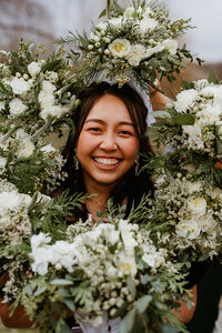 bride surrounded by bridesmaids bouquets