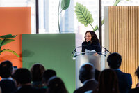 A woman speaking at a conference