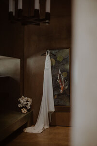 Bridal gown hangs in a luxury Airbnb
