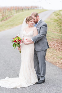 bride and groom photos on drive way at sanders ridge winery wedding