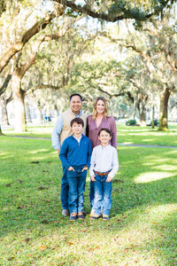 family of four under the oaks in downtown savannah