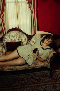 Kenna on a couch with a cool little camera.