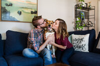 couple with their dog in home