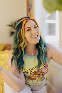 woman with colorful hair smiling