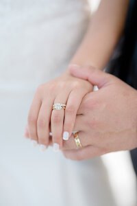 Bride and groom posing on the beach for portraits at Cape May wedding