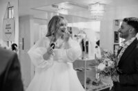 A bride puts lipstick.
