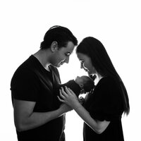 Image of new parents with their baby at a studio newborn photography session by Hobart Newborn Photographer, Lauren Vanier
