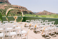 White chairs set up for wedding ceremony in Sedona AZ