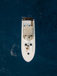 couple walking along beach with lanterns