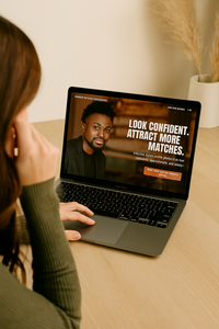 A person browsing the Shannon Kathleen Photography website on a laptop, researching online dating profile photographers in Minneapolis and exploring session options.